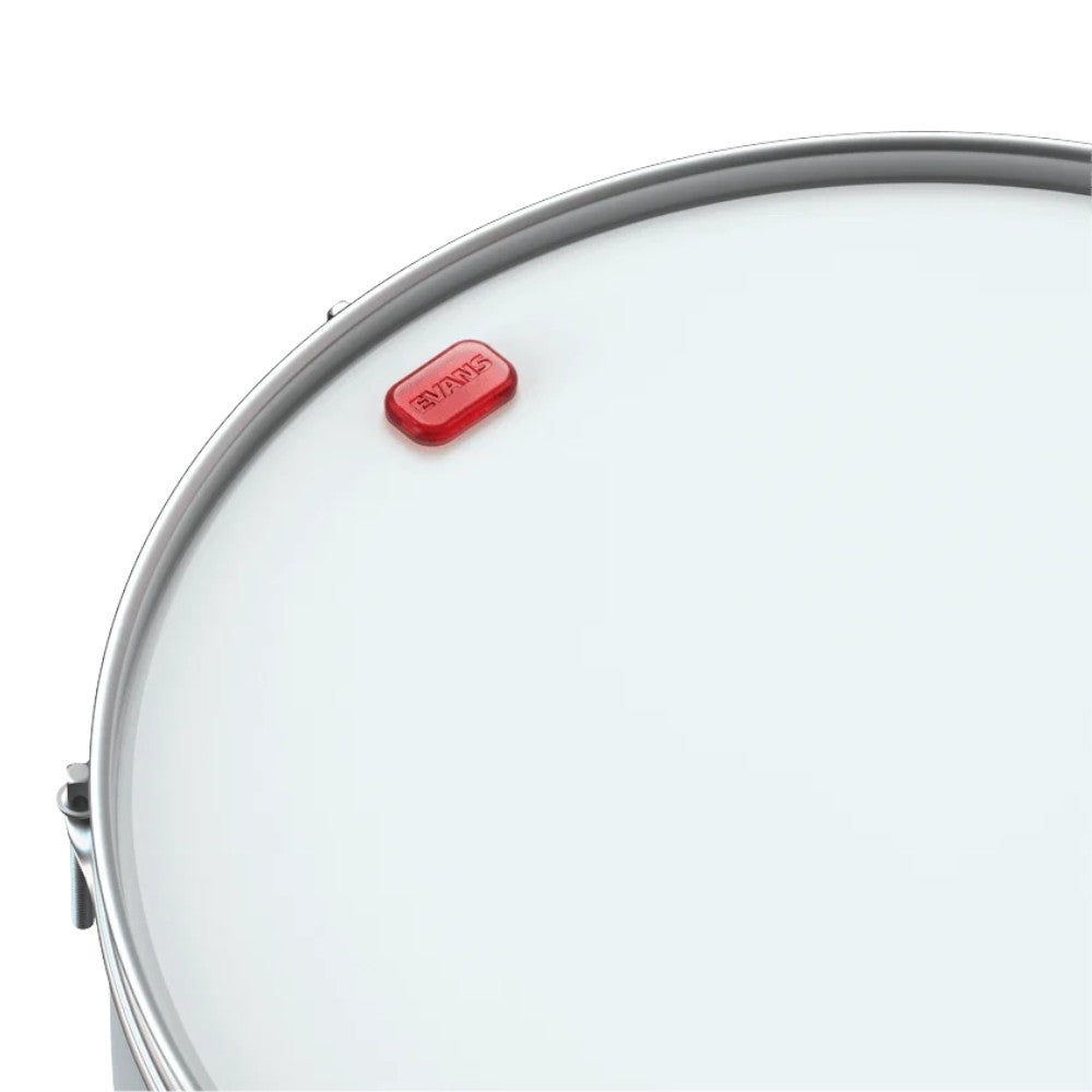 Evans Mini EQ Pod positioned on a drumhead for overtone control