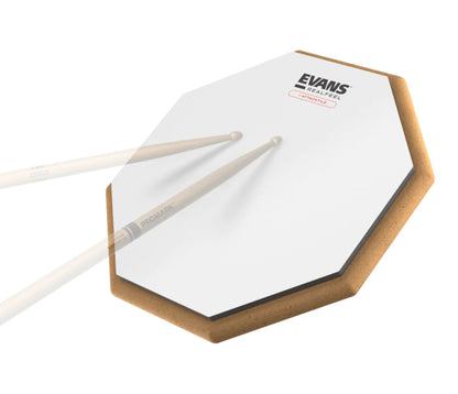 Evans RealFeel Attacktile 10-inch practice pad being played with drumsticks