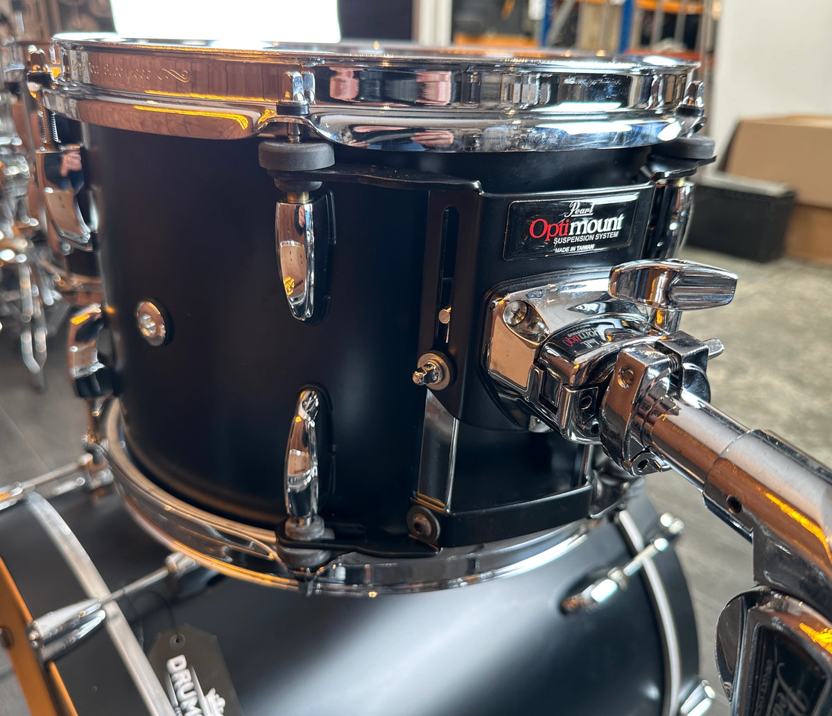Close-up of Pearl Optimount tom mounting system on Matt Caviar Black rack tom