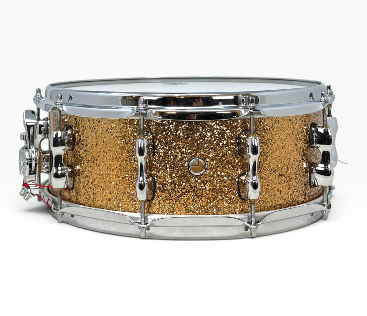 Sakae Evolved 14" x 5.5" Snare Drum in Gold Champagne – side view with shell air vent