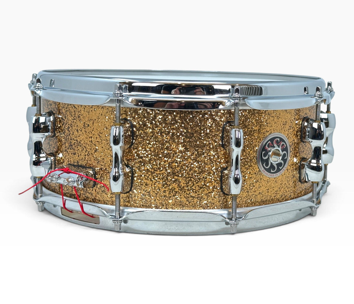 Sakae Evolved 14" x 5.5" Snare Drum in Gold Champagne – angled shell and hardware view
