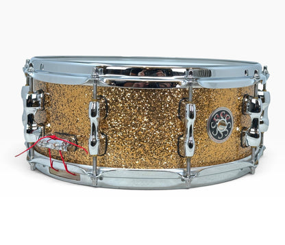 Sakae Evolved 14" x 5.5" Snare Drum in Gold Champagne – angled shell and hardware view