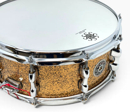 Sakae Evolved 14" x 5.5" Snare Drum in Gold Champagne – close-up of batter head and sparkle finish