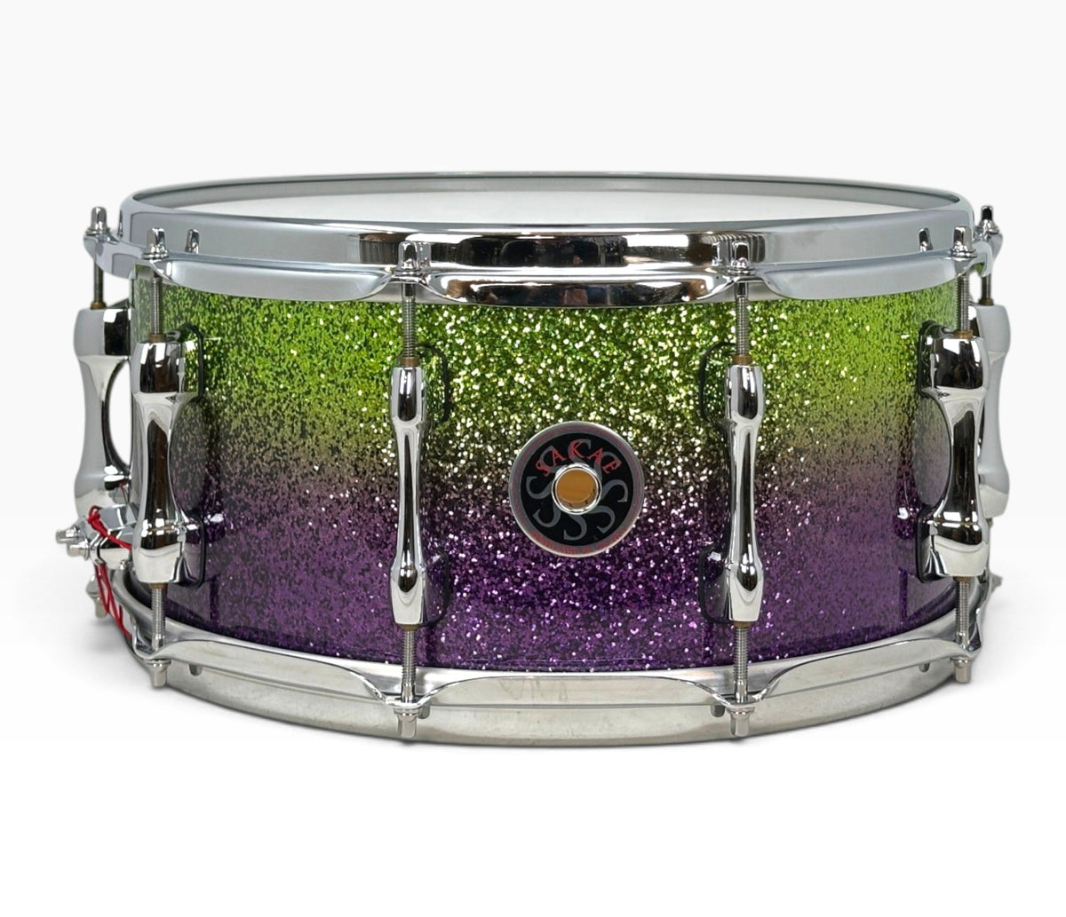 Sakae Evolved 14" x 6.5" Snare Drum in Grapes Green to Purple Sparkle – side view with Sakae badge
