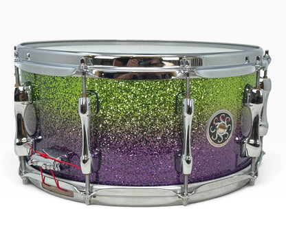 Sakae Evolved 14" x 6.5" Snare Drum in Grapes Green to Purple Sparkle – angled shell and hardware view
