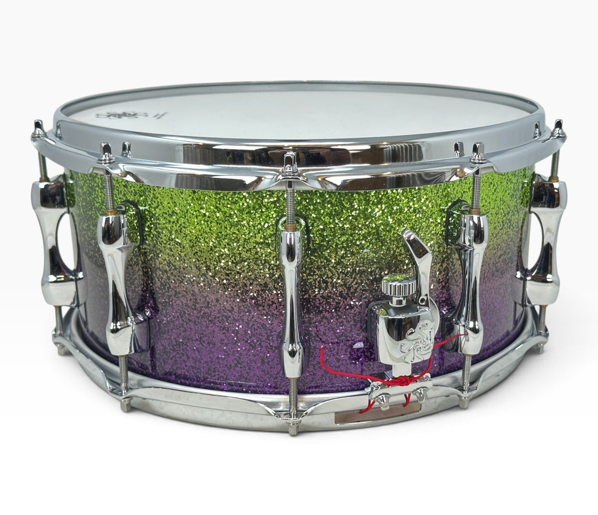 Sakae Evolved 14" x 6.5" Snare Drum in Grapes Green to Purple Sparkle – angled strainer side view