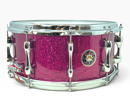 Sakae Evolved 14" x 6.5" Snare Drum in Magenta Sparkle – angled shell and hardware view