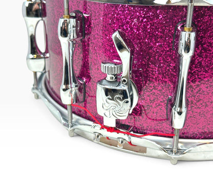 Sakae Evolved 14" x 6.5" Snare Drum in Magenta Sparkle – detailed strainer and shell view