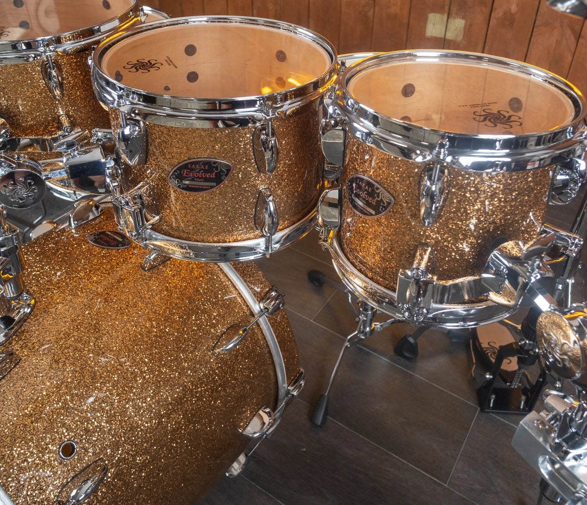 Sakae Evolved Gen2 rack toms and bass drum in Gold Champagne Sparkle