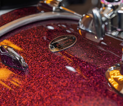 Sakae Evolved Gen2 bass drum badge and Magenta Sparkle finish – close-up