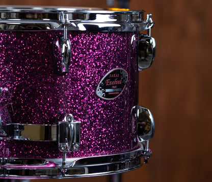 Sakae Evolved Gen2 badge on Magenta Sparkle maple tom shell