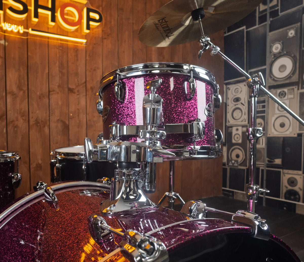 Sakae Evolved Gen2 mounted rack tom above Magenta Sparkle bass drum