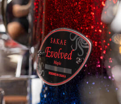 Sakae Evolved Gen2 maple shell badge on Fire & Water Sparkle finish