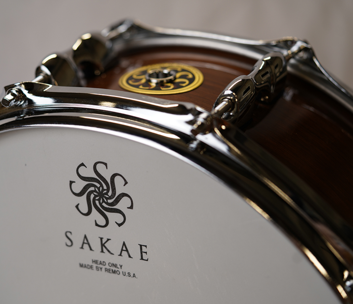 Sakae MIJ 14" x 5.5" Walnut Snare Drum – head logo and hoop detail