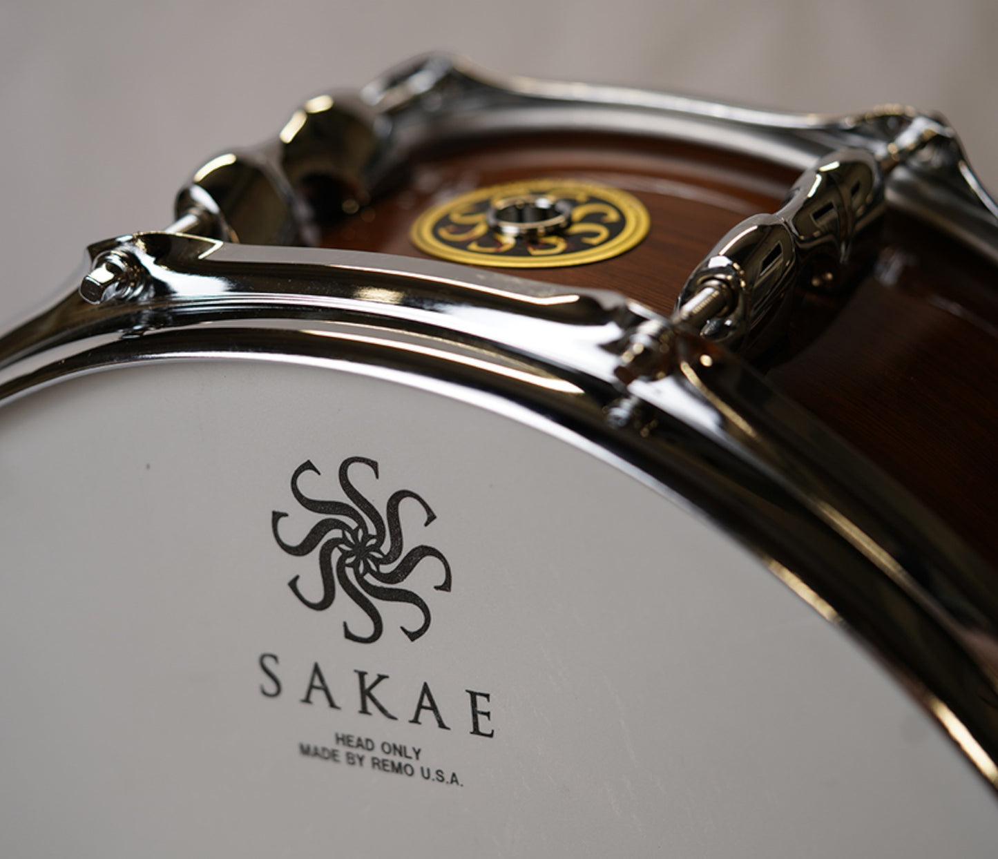 Sakae MIJ 14" x 6.5" Walnut Snare Drum SD1465WNJ head logo closeup